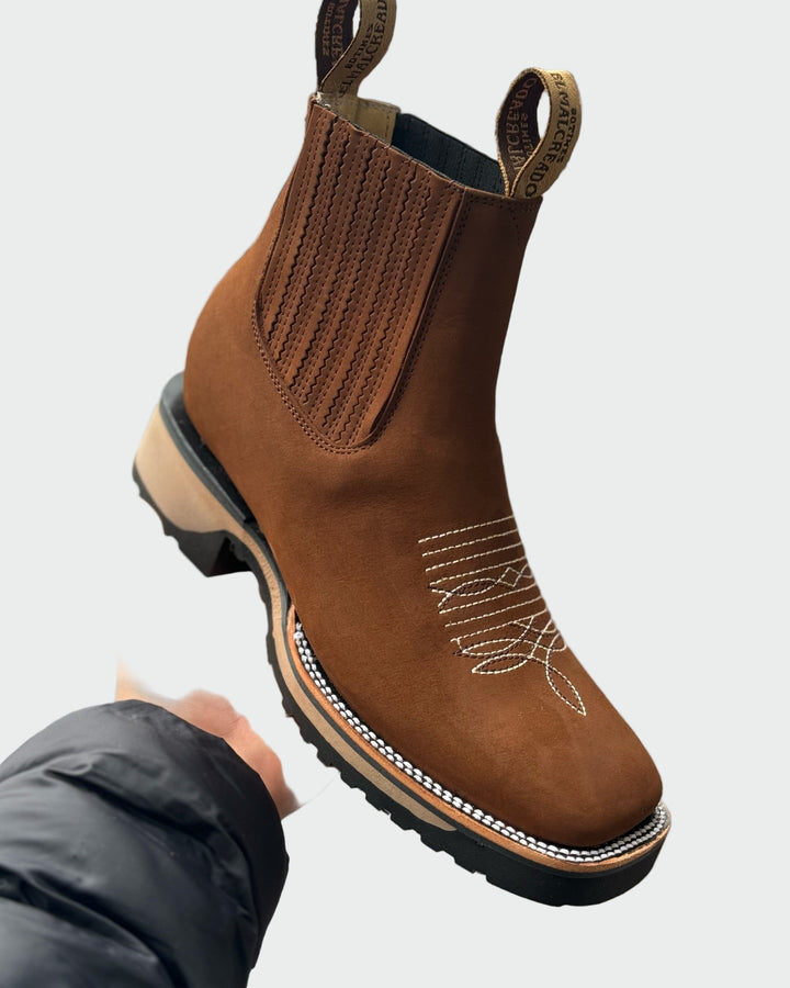 Botas de cowboy em pele